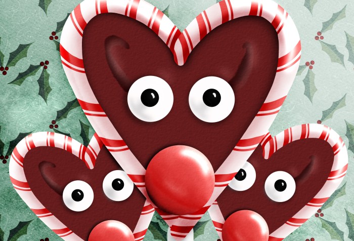 three chocolate suckers that look like rudolph with candy canes heart shaped around the face
