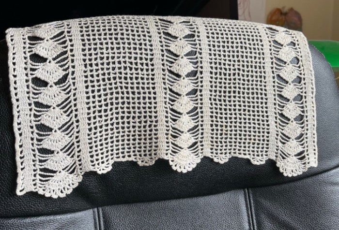 Crocheted doily draped across black office chair— One of my grandmother’s antimacassars - she also crocheted matching ones for the armrests