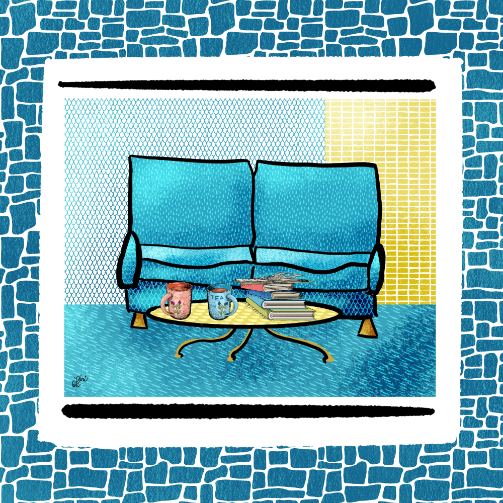 blue sofa behind yellow coffee table with stack of books/ photo albums and two coffee mugs