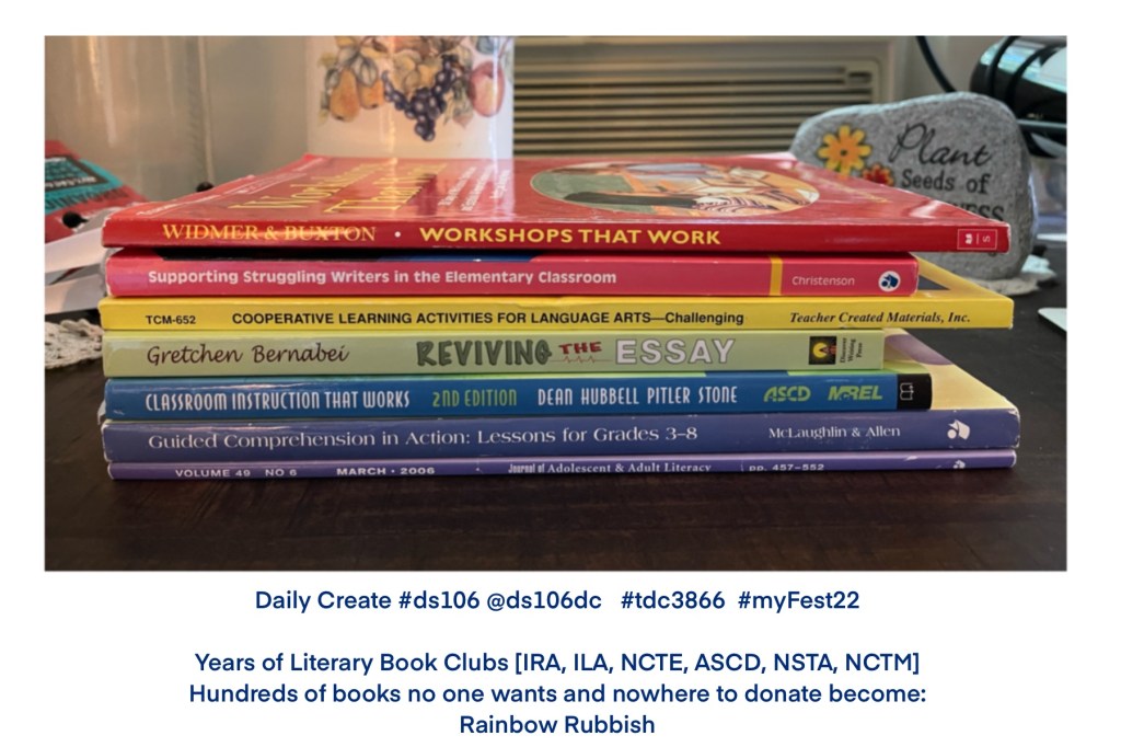 a stack of educational professional books stacked in rainbow color order