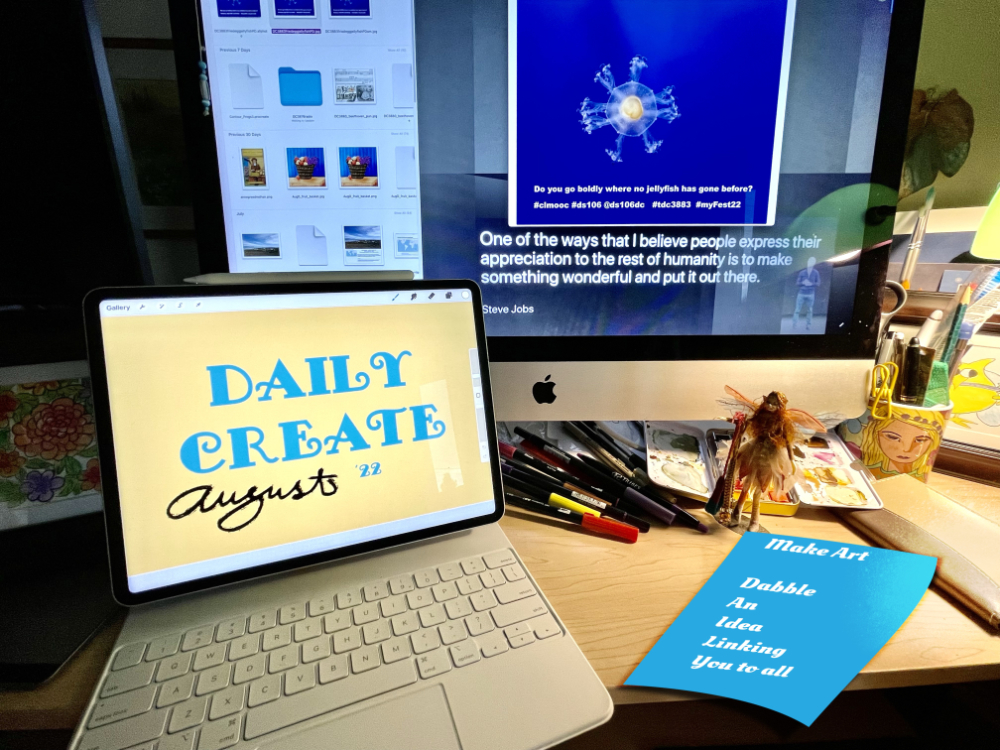 ipad and computer with creative items like markers, drawings, watercolor scattered aroun