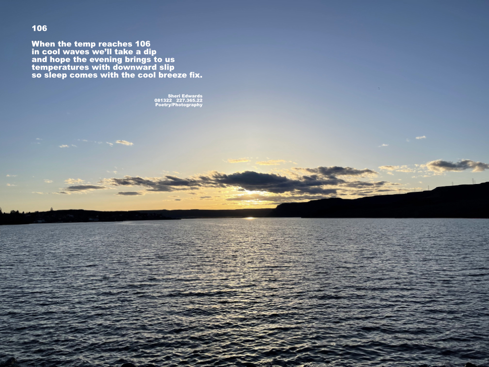 sunset on lake waves with clouds obstructing the sun in an orange gradient along the cliff horizon